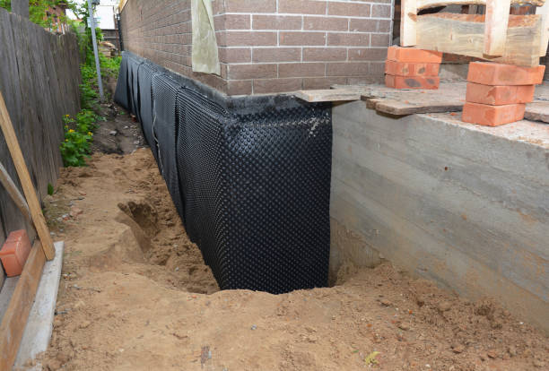 Happy homeowners after waterproofing job in Alpine